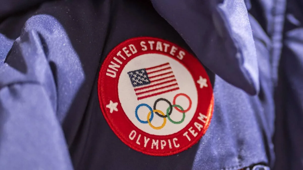 The olympic rings are on top of the eiffel tower